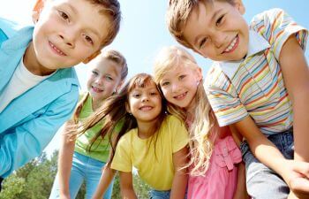 Group of five happy kids